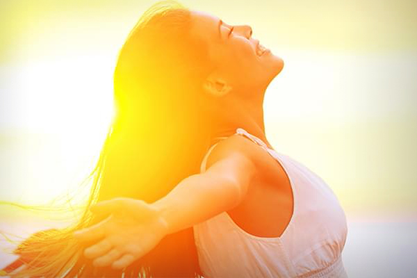 Image of Woman Enjoying Sunset